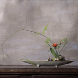 Long white ikebana vase