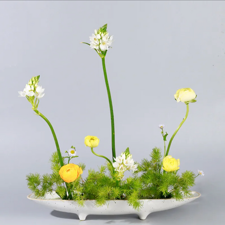Long white ikebana vase