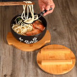 Japanese bowl with chopsticks and spoon